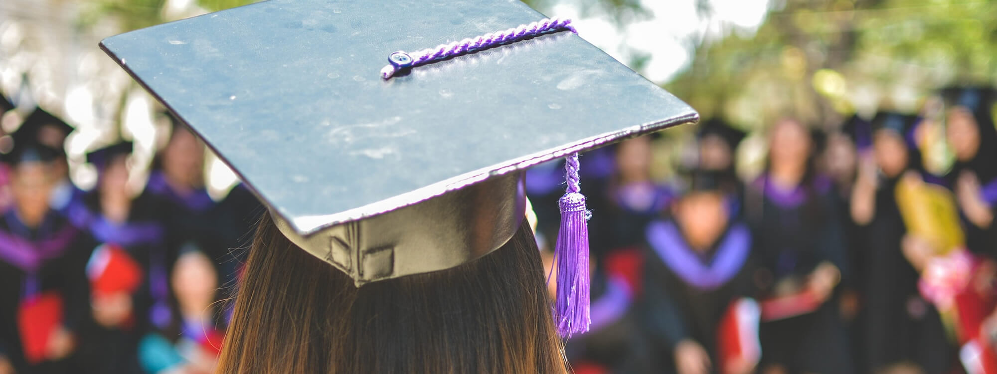 Graduate wearing a mortar board.