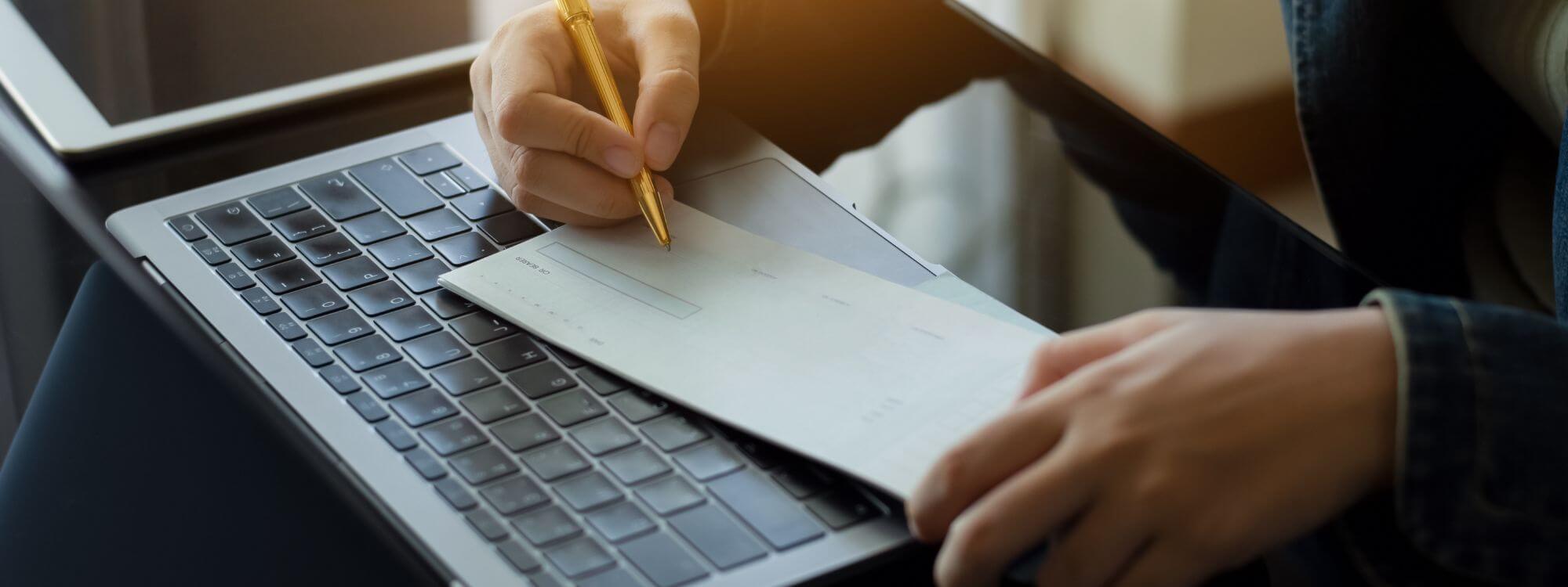 Banner for Kasasa Checking showing a person writing a check.