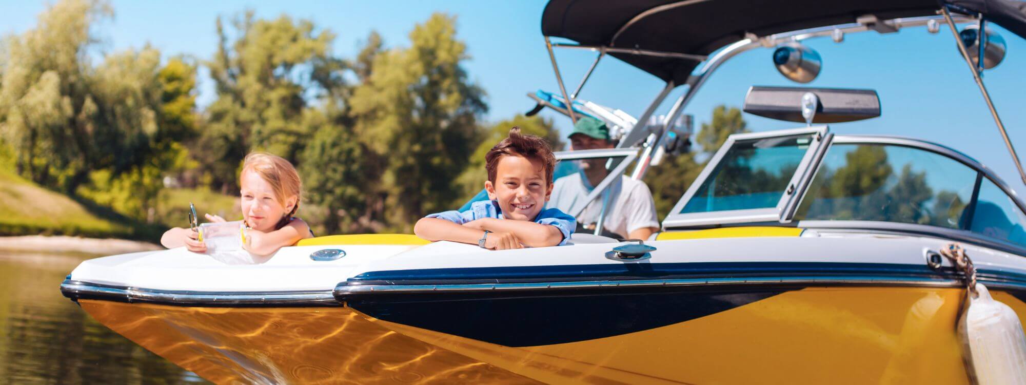 Banner for recreational loans showing a family boating on a lake.